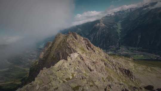 FPV穿越云层鸟瞰航拍巍峨山峰山脉山脊高山