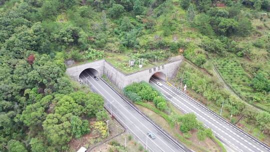 航拍高速公路隧道汽车行驶出来行驶进去隧道