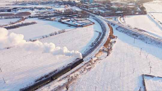 航拍中国东北冬季雪景中的蒸汽机车老火车