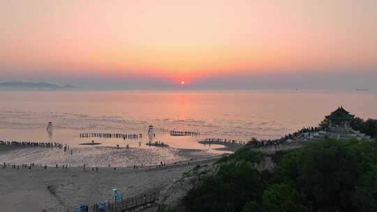 航拍北戴河鸽子窝湿地公园海上日出