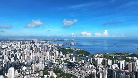 航拍夏季蓝天白云下的海南海口滨海城市风光