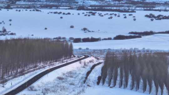 航拍雪景下的牙克石道路