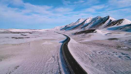 航拍蓝天白云雪山公路自然风景