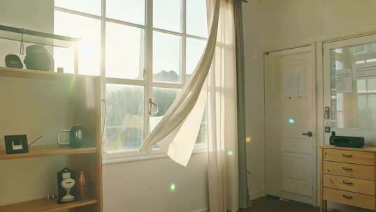 室内窗户阳光照射飘动窗帘