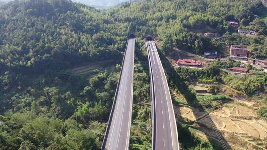 高速公路汽车进出隧道航拍高架桥货车高速路视频素材模板下载