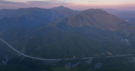 航拍大山里高速公路 山顶上电塔