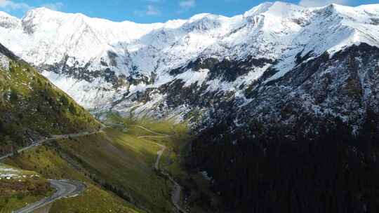 航拍西藏高原雪山和环山公路