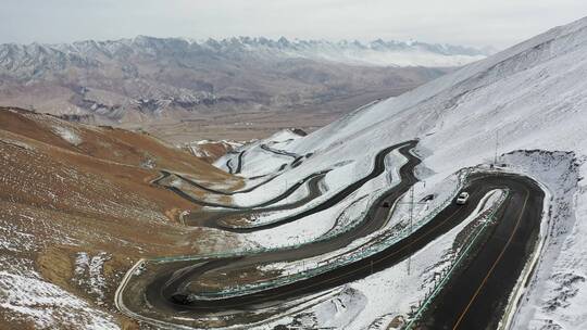 航拍新疆塔县帕米尔高原盘龙古道雪山公路