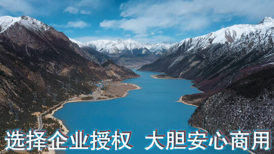雪山湖泊视频青藏高原湖泊蓝色湖水周围雪山