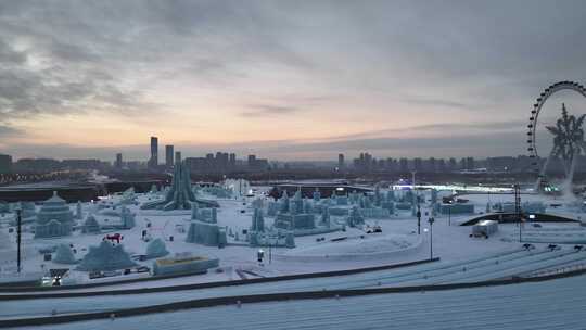 航拍哈尔滨冰雪大世界晚霞夕阳朝霞灯光夜景