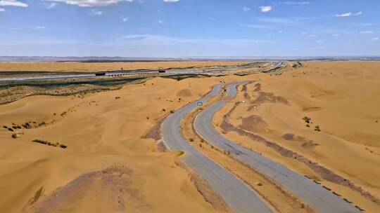 高清航拍甘肃沙漠公路蓝天白云自然风光视频素材模板下载