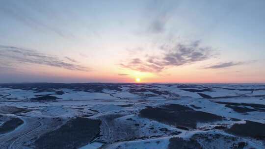 航拍丘陵山地雪景暮色云彩延时