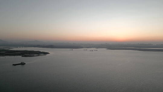 厦门环东海域晨光中的海边和城市建筑航拍