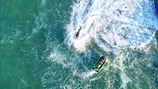 海南三亚高视角航拍水上项目空中飞人摩托艇