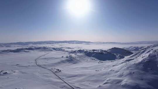 航拍新疆阿勒泰雪景吉木乃草原石城输电线路