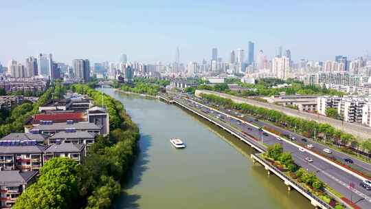 城市河流两岸风景及繁忙交通景象