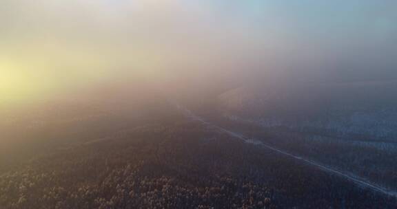 航拍冬季山林雾凇冷空气朝阳