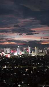 竖屏航拍城市晚霞夜景广西玉林夜景