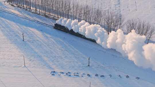 航拍中国东北冬季雪景中的蒸汽机车老火车