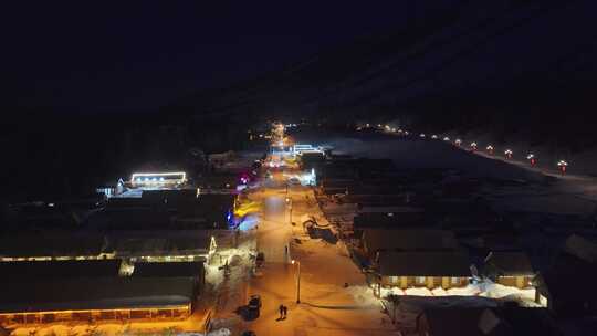 航拍新疆喀纳斯老村冬季夜景雪地小木屋