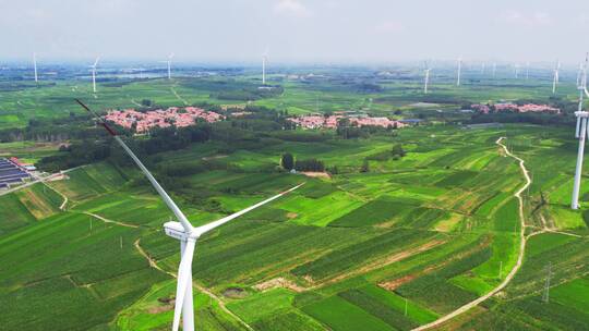 航拍乡村农田绿色能源风力发电机特写