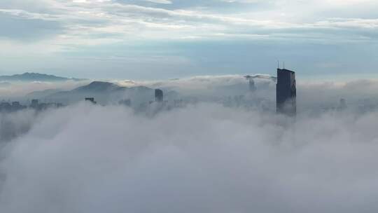 浙江湖州城市地标云雾笼罩下的城市鸟瞰全景