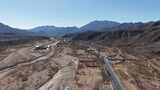 航拍山间蜿蜒公路高清在线视频素材下载