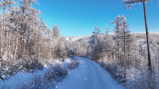 航拍林海雪原雪林山路