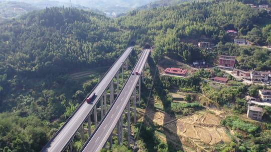 高速公路汽车进出隧道航拍高架桥货车高速路视频素材模板下载