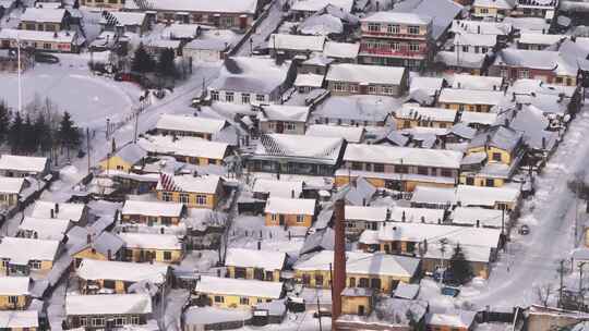 雪乡东北风景白雪覆盖下的村庄全貌航拍