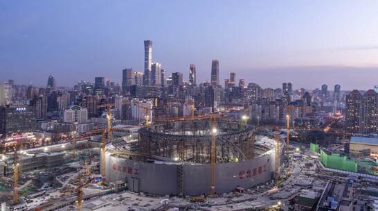 北京城市夜景新工体延时摄影4K日转夜视频素材模板下载