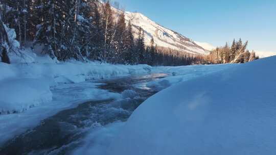 阿勒泰禾木冬季冰雪河流瀑布航拍风景