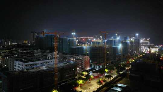 建筑工地施工航拍夜景剪影视频塔吊建设城市