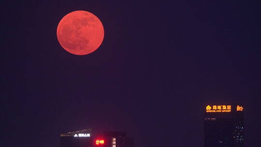红月亮从北京望京升起的延时摄影