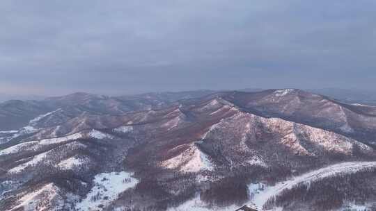 航拍寒冬山区山林雪景暮色