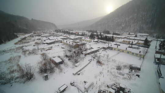 航拍东北山区冬天村庄冰雪