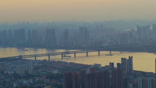 武汉市江滩航拍长江大桥货轮夕阳
