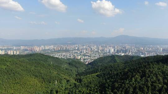 航拍山川丘陵城市蓝天白云