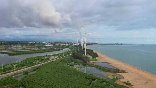 航拍中国海南海边的风车