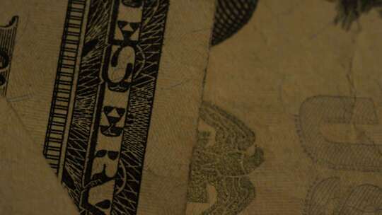 美国鹰盾背景上美国纸币的旋转镜头-MONEY 0414视频素材模板下载