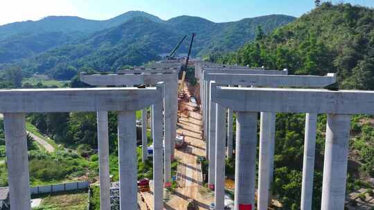 建设工地航拍大山里工程建筑高速桥梁施工