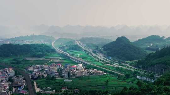 贵州喀斯特地貌中的城市与高铁火车航拍风光