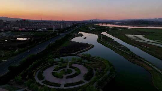 航拍宁夏石嘴山夕阳下的黄河湿地石嘴子公园视频素材模板下载