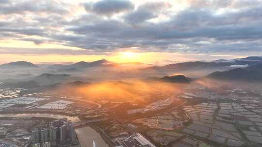 航拍深圳福田香港落马洲日出金光