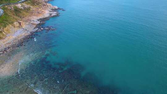 航拍海南三亚西岛海洋文化旅游区海浪礁石