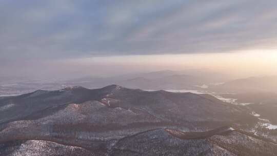 航拍寒冬山区山林雪景暮色