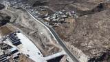 航拍山间蜿蜒公路高清在线视频素材下载