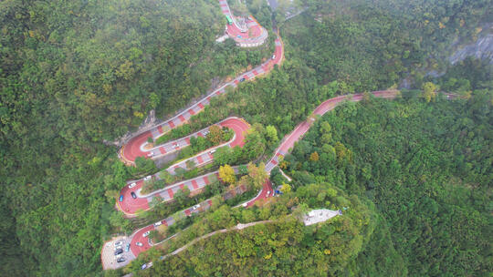 航拍湖南湘西德夯苗寨蜿蜒的彩色山路