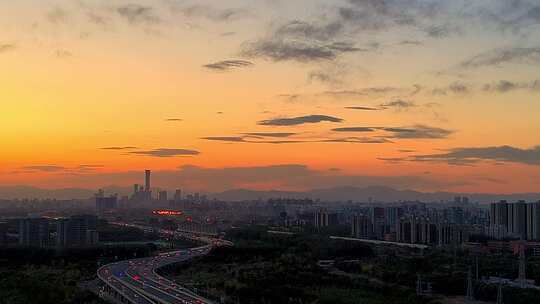 秋天北京国贸CBD傍晚日落晚霞与车流