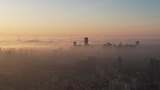 航拍 夕阳笼罩城市云雾高清在线视频素材下载